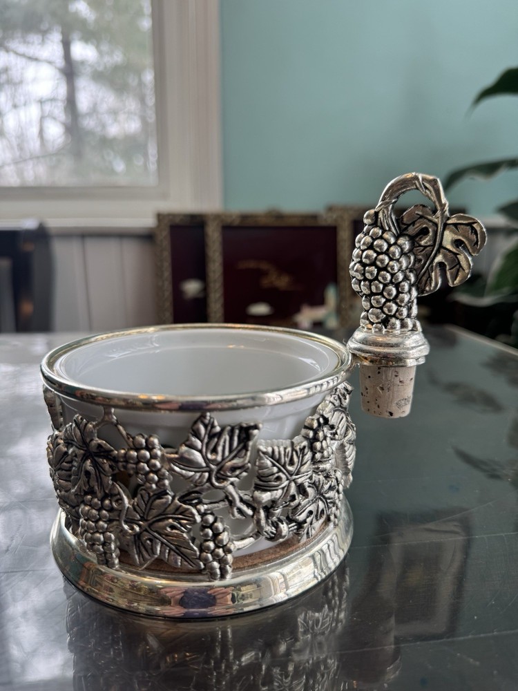 Godinger silver-plated wine bottle coaster with a grapevine design