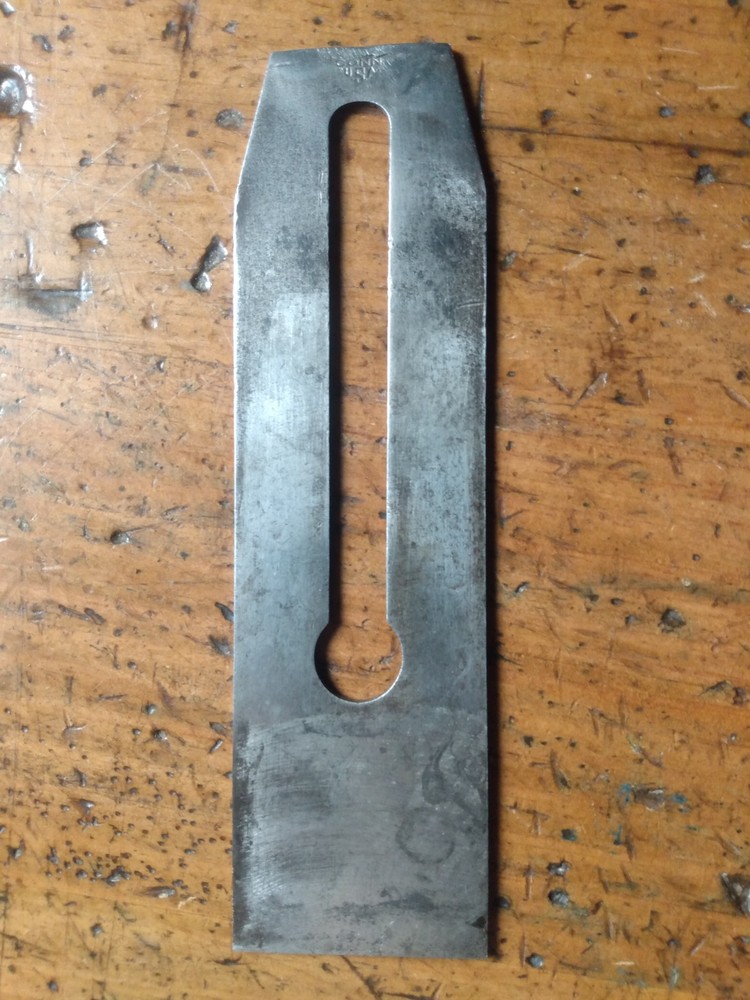 STANLEY 2" V-LOG0 (distressed) PLANE BLADE. READ FULL DESCRIPTION.