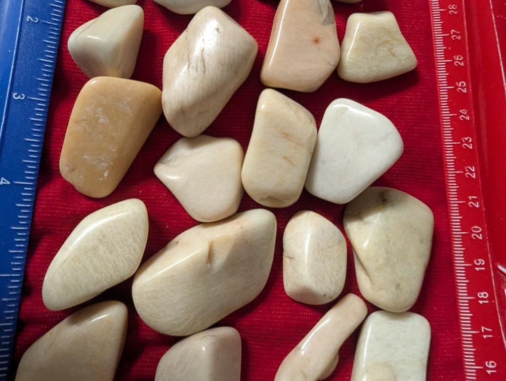 2 Off white large tumbled gemstones per lot.