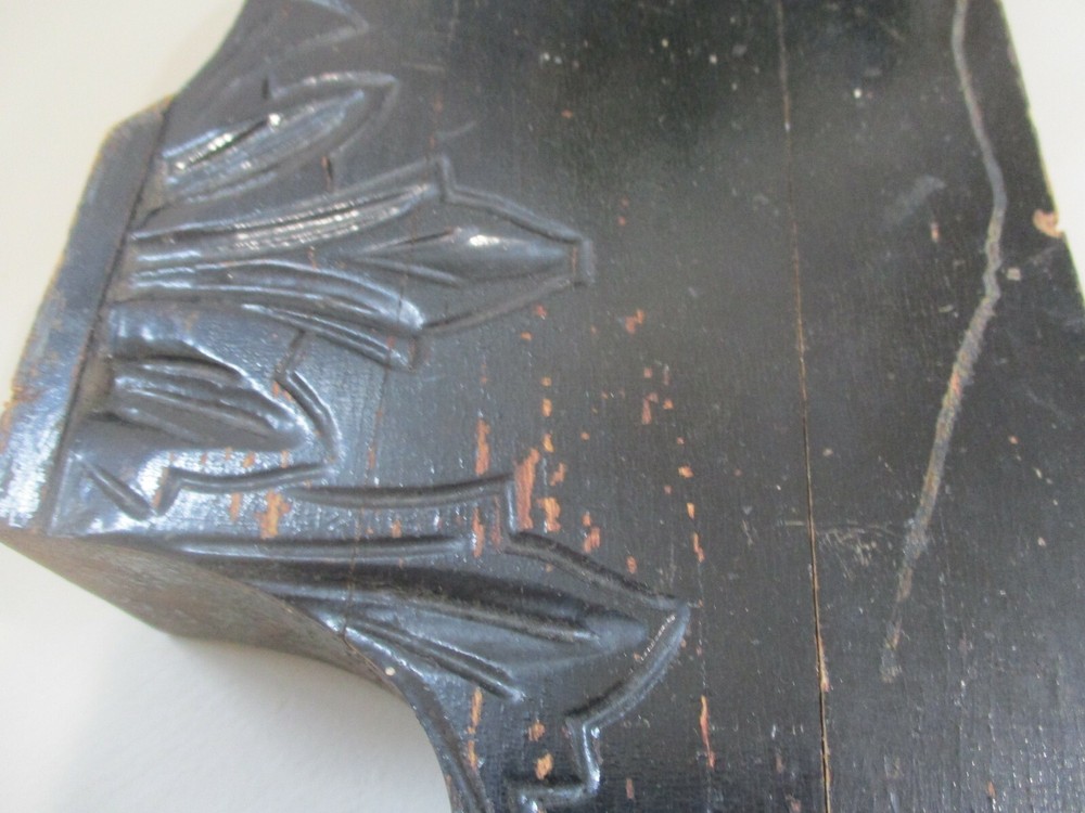 Antique painted black corbel.