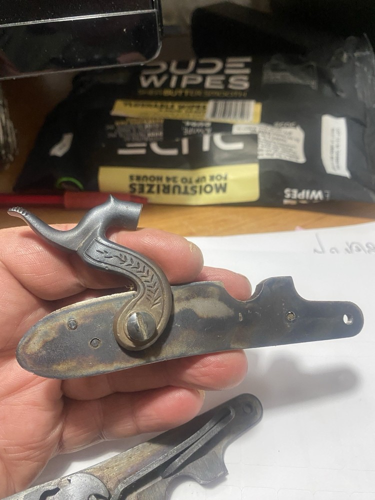 CVA Frointier Muzzleloader Lock and two screws.