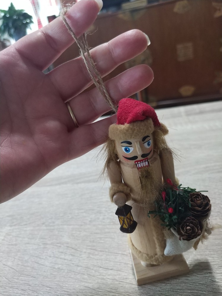 Handcrafted, painted wood Christmas nutcracker ornament