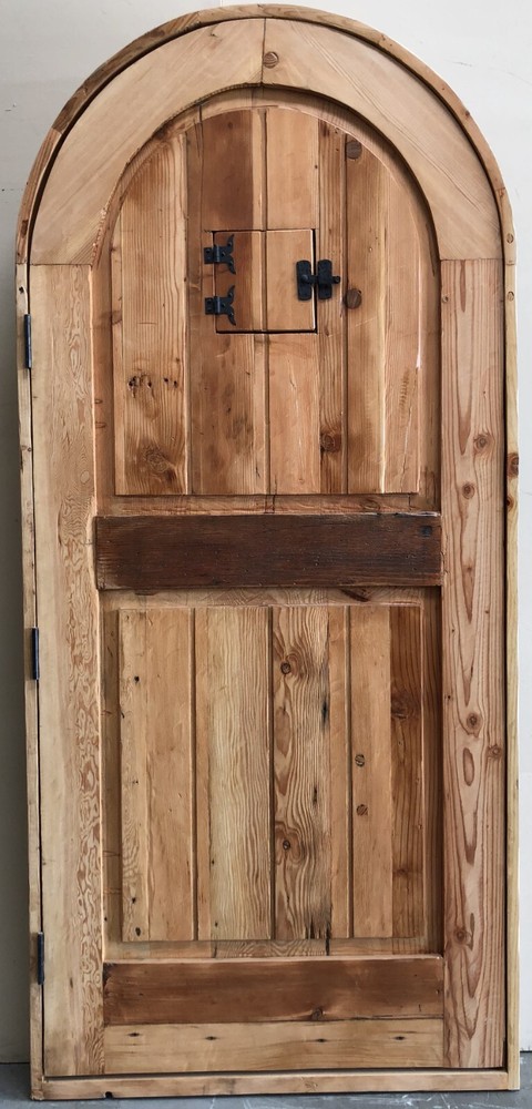 Rustic castle reclaimed lumber arched old growth Doug Fir solid door winery