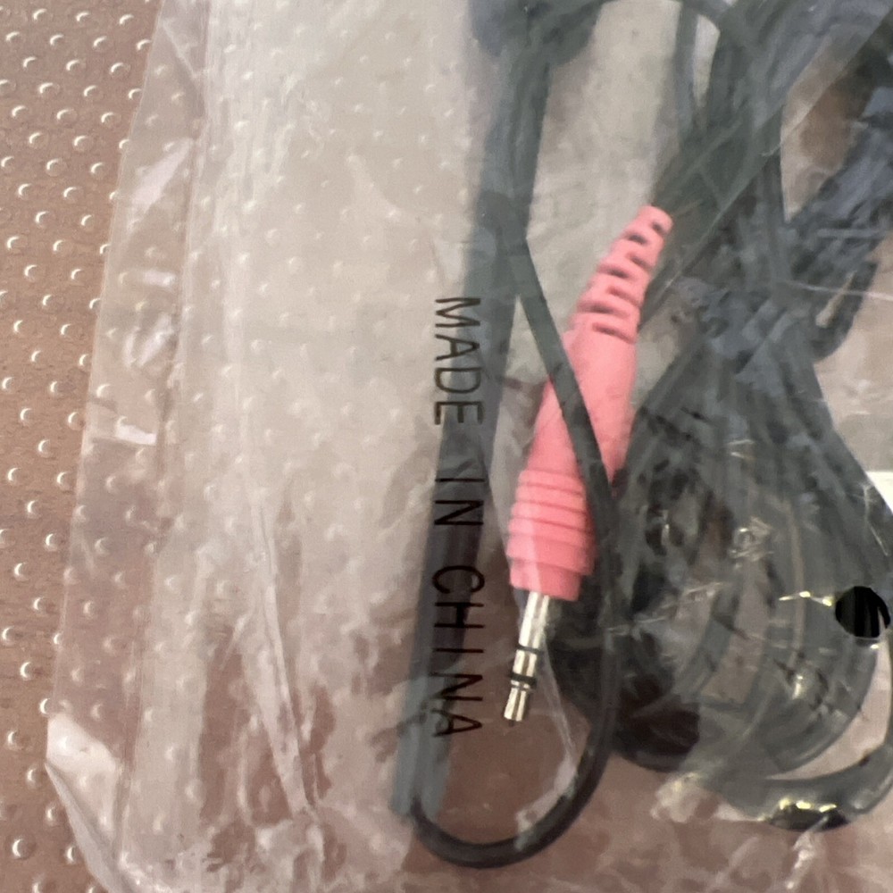 Mini microphone attachable to wall or desk