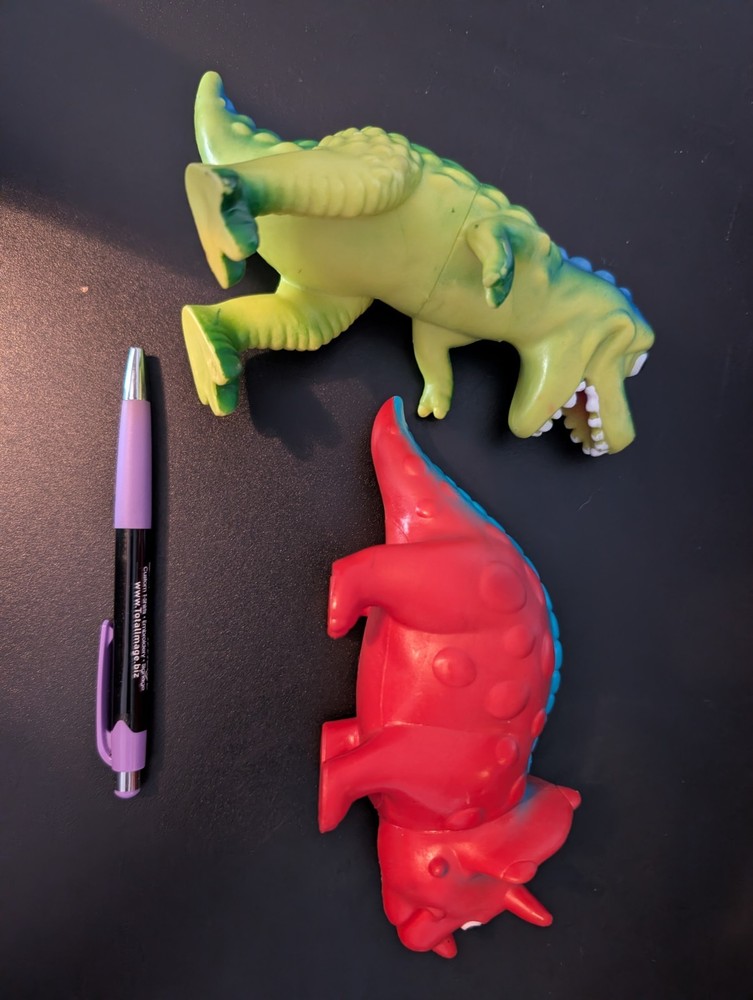 Two Plastic Toy Dinosaurs
