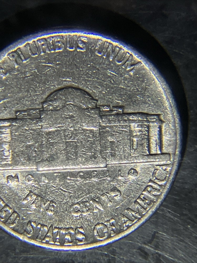1980 D Nickle Struck Through Grease