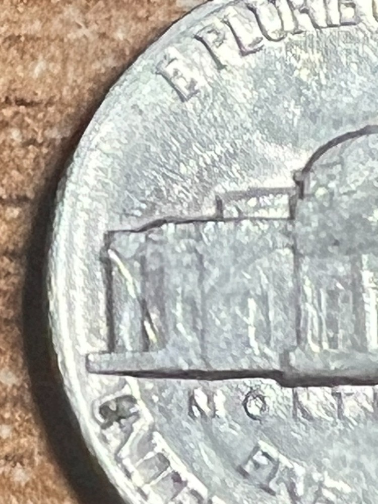 1982 ERROR JEFFERSON NICKEL STRUCK THROUGH AN OBJECT