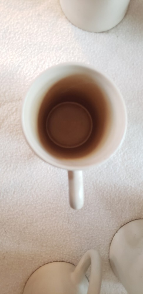 Vance Kitira 12-ounce handled coffee mugs / teacups.