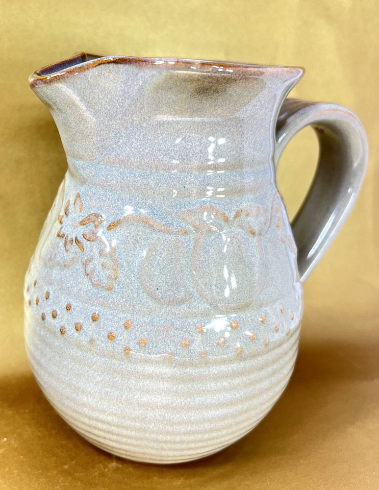 Unbranded Glazed Stoneware Pitcher embossed with fruit and glazed inside
