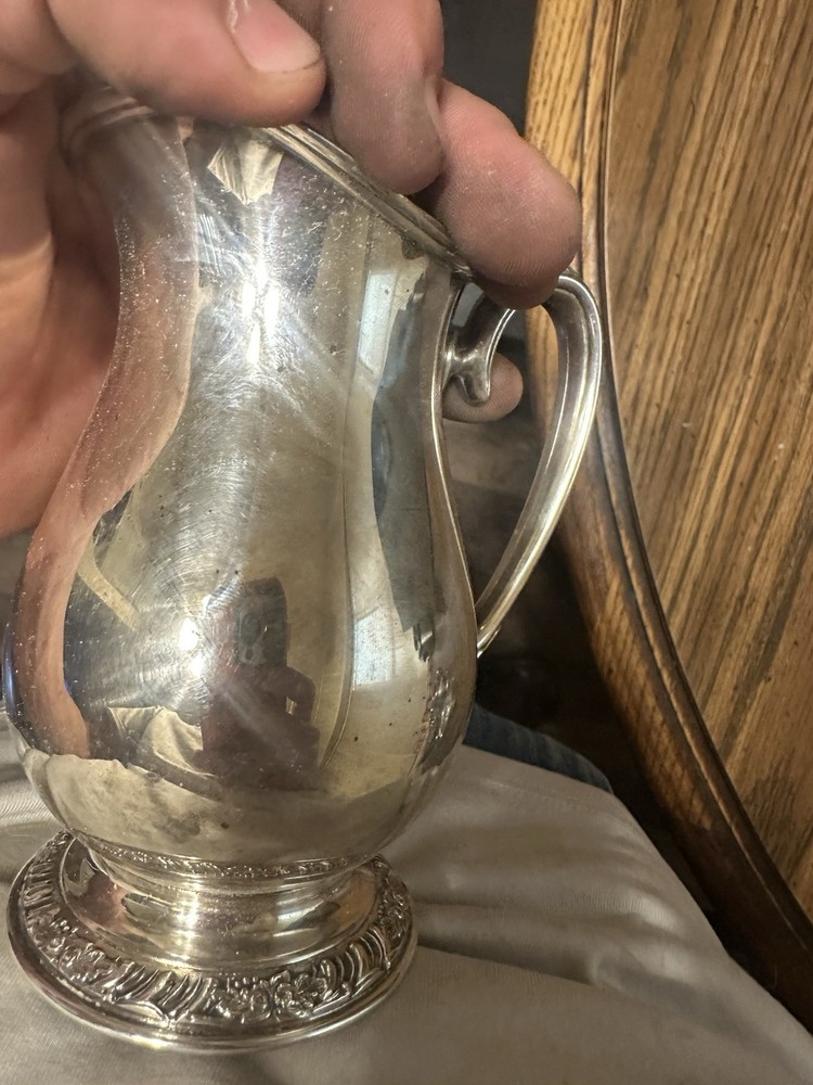 Set Of Four Silver Plated Cups.