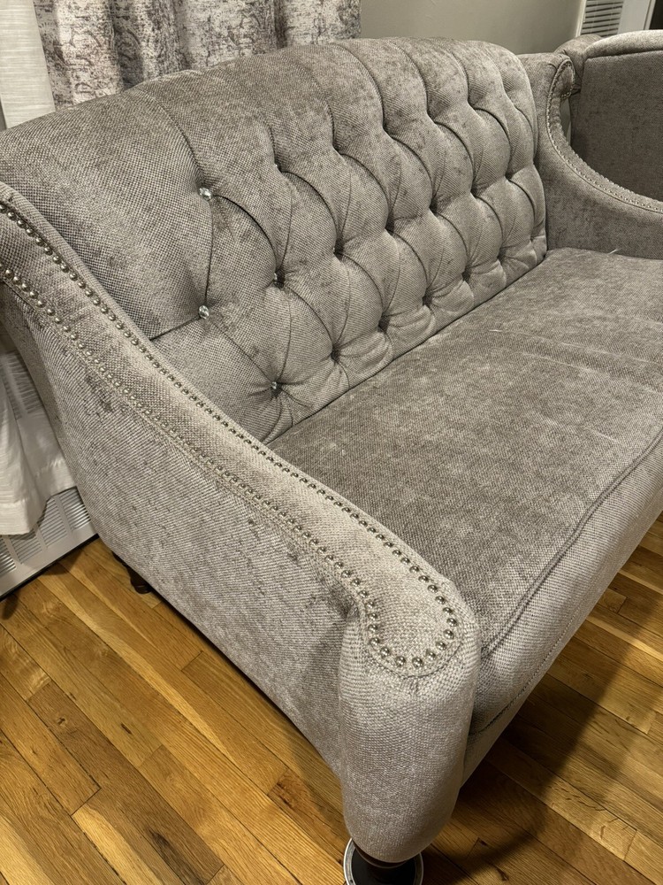 Light grey sofas/ couches.