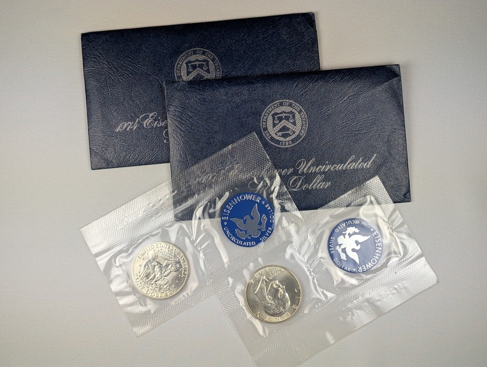Two (2) 1974 Eisenhower 'Ike' Silver Dollars, Uncirc. Blue Envelope, 2 Coins